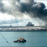 Jebel Ali Port, after one of the berths caught fire because of debris from an intercepted Iranian missile, in Dubai