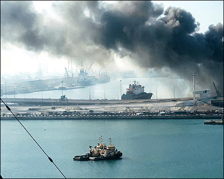 Jebel Ali Port, after one of the berths caught fire because of debris from an intercepted Iranian missile, in Dubai