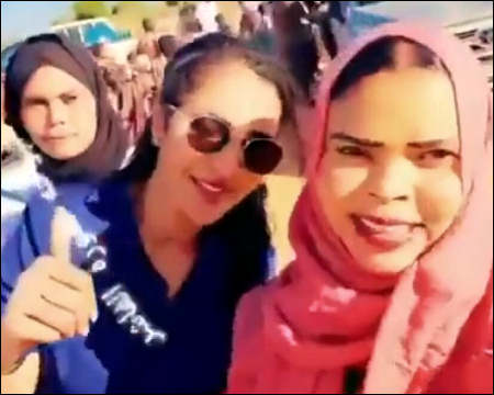 Sky News Arabia presenter Tsabih Mubarak with RSF officer in El-Fasher