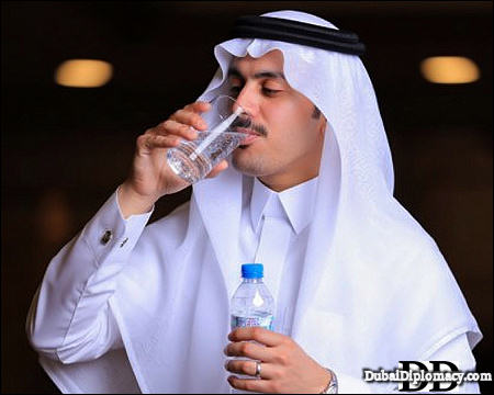 Arab man drinking water Dubai UAE 2026 DubaiDiplomacy.com