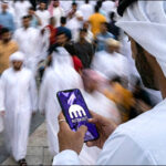 Emirati man Kraken smartphone crypto bitcoin