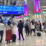 Passengers Dubai airport UAE 2025
