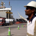 Worker cargo Fujairah port UAE, May 6, 2026