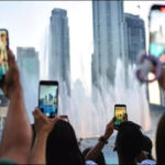 People film smartphone Dubai fountain UAE May 27 2026